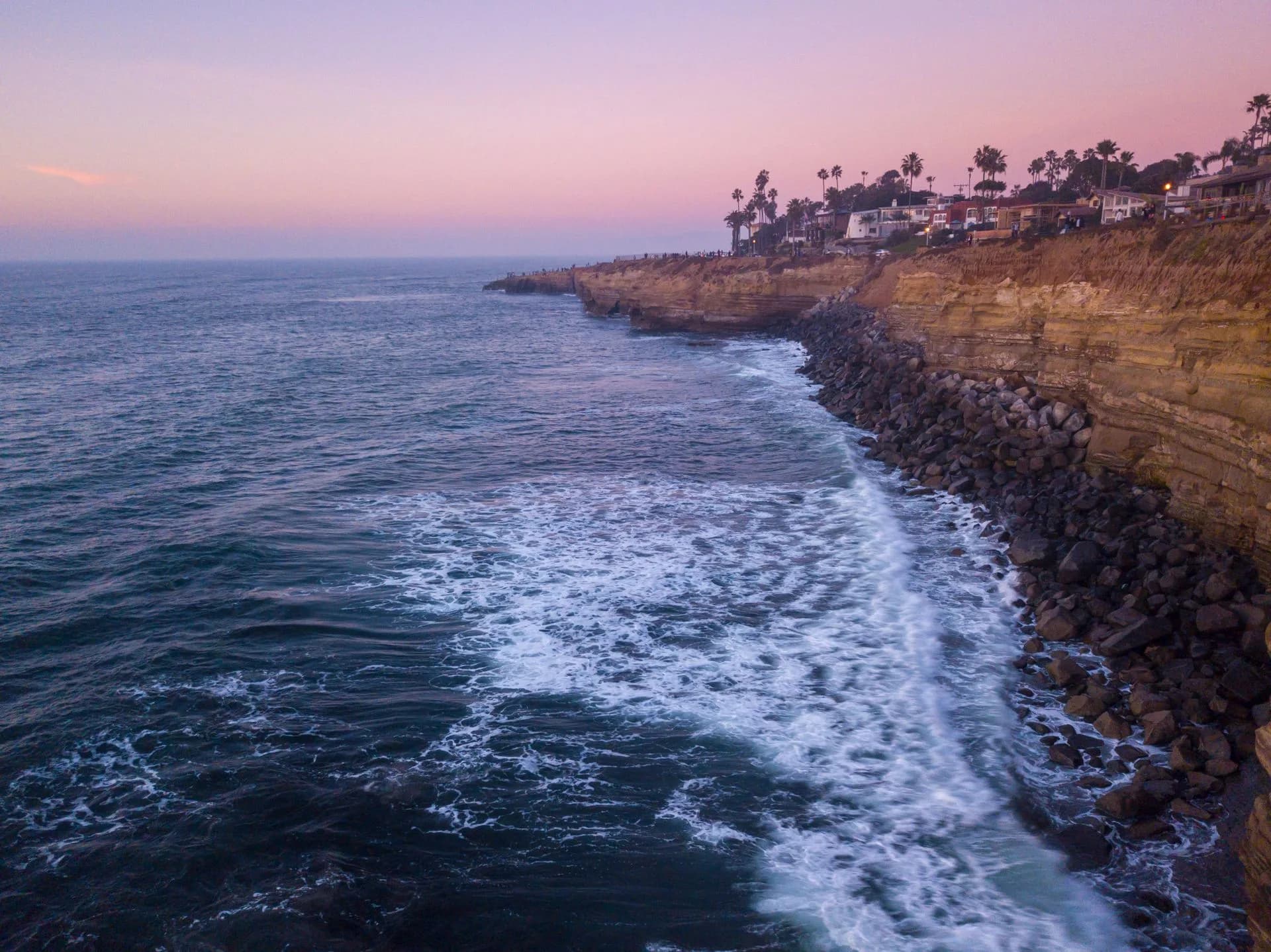 Sandstone cliffs and coastal homes above the Pacific Ocean at Sunset Cliffs in San Diego, California