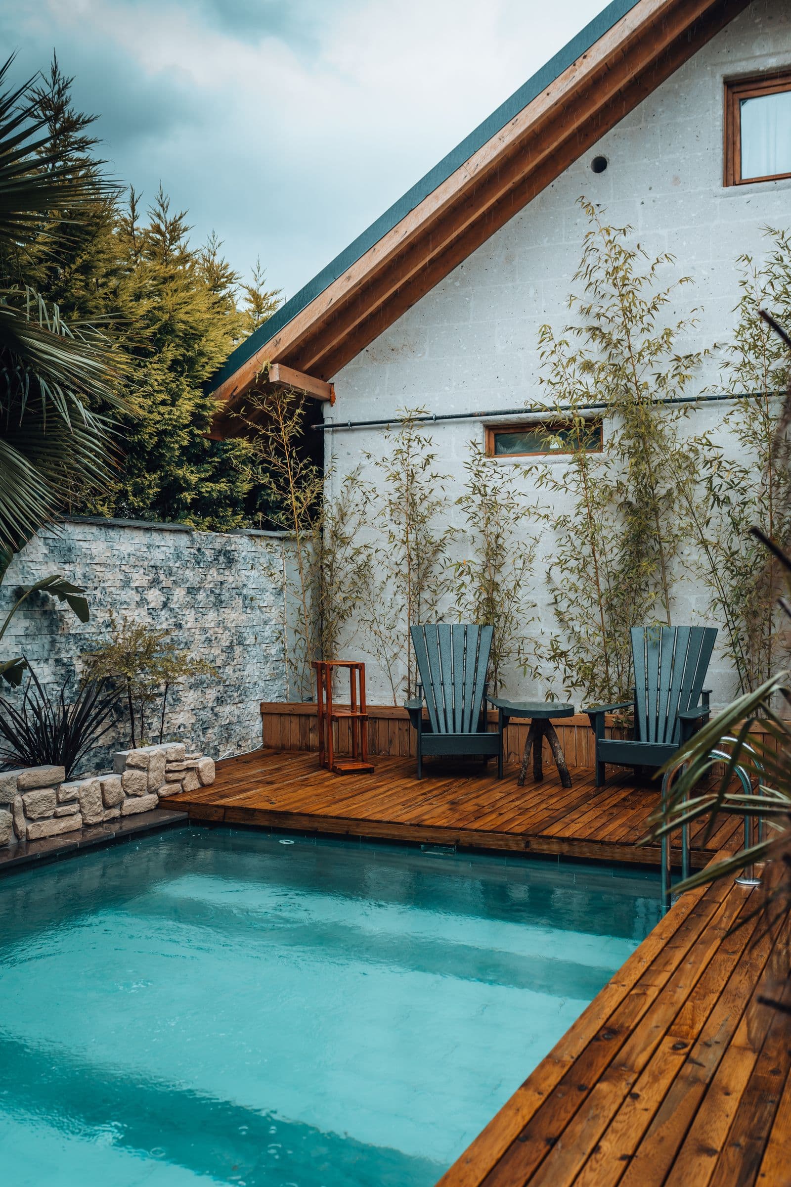 Home with pool and palm trees at dusk